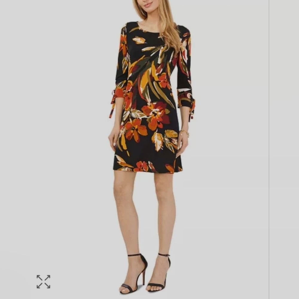 Splashed with bold floral shades on stretchy jersey-knit, this MSK petite shift